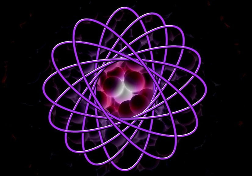 Picture demonstrating what is an atom in simple terms or a Qubit. Purple rings around centre and side spheres
